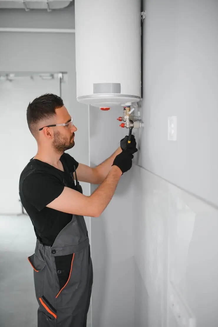 Technician working on boiler installation