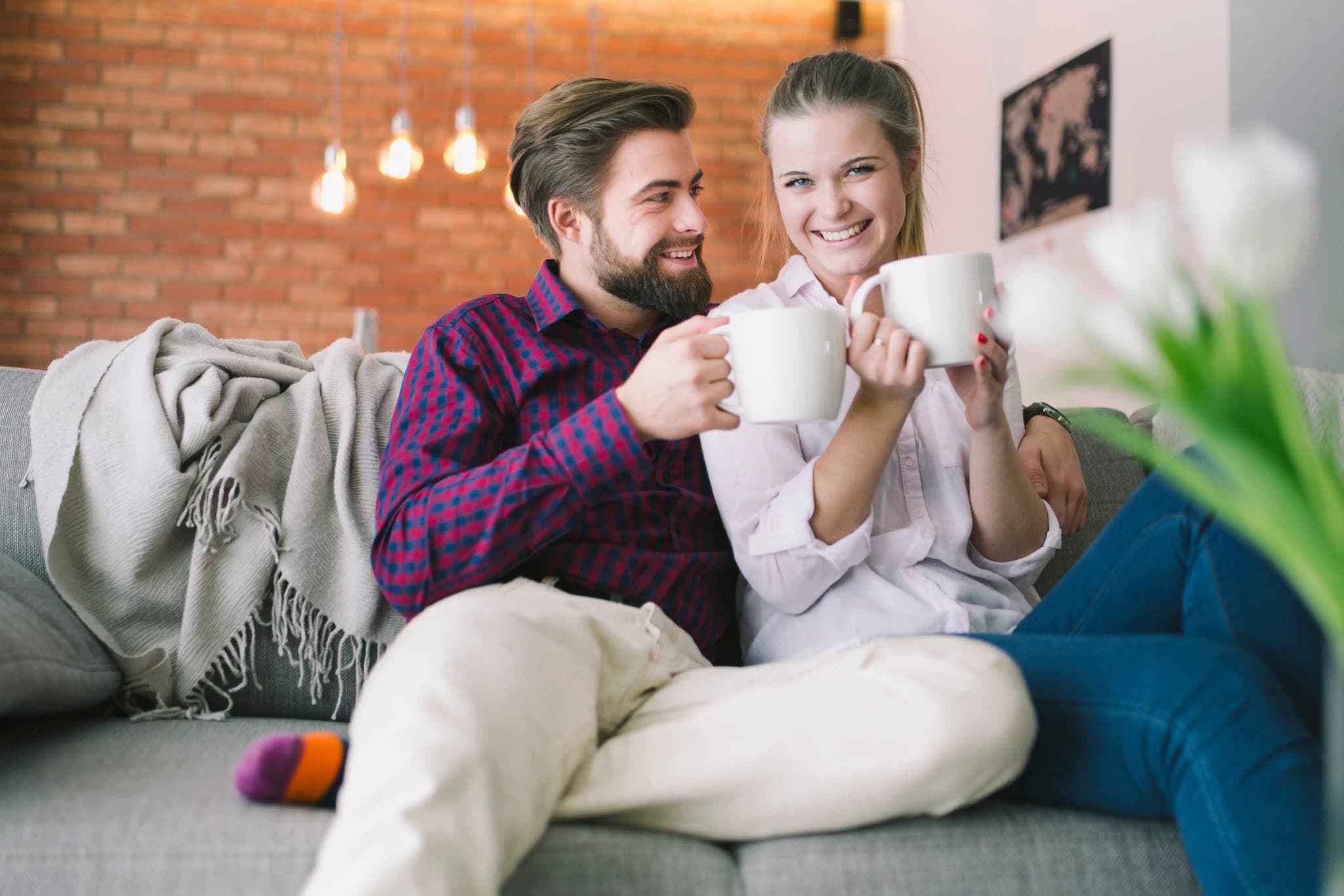 Happy couple enjoying warm home